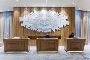 Modern hotel reception counter with a wooden design.