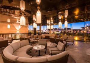 Modern lobby with fabric seating, metal accents, and glass elements.