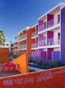 A modern residential building painted with bright, colorful paint.