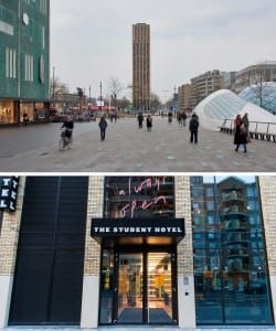 A modern hotel exterior featuring glass and concrete materials, with a tall tower in the background and a spacious plaza area