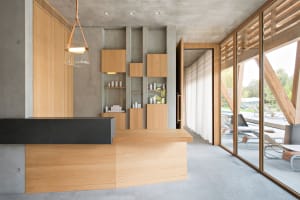A modern interior design featuring a reception counter crafted from wood and concrete.