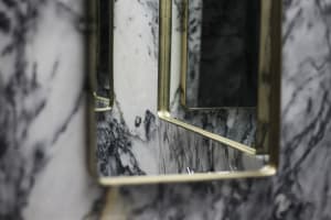A modern marble bathroom with a sleek, polished finish.