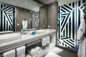 A modern bathroom interior with minimalist black and white design elements.