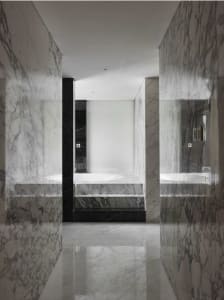 Modern minimalist bathroom with marble walls and flooring