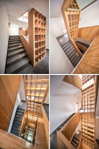 Modern staircase with a wooden open-grid design in an interior space.