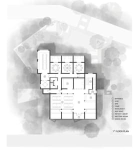 A white architectural drawing depicting the ground floor layout of a modern building.