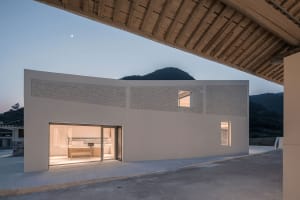 Modern residential space featuring concrete and glass materials.