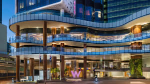 Modern design hotel lobby featuring glass walls and wooden structural elements