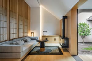 A modern minimalist living room featuring wood elements.