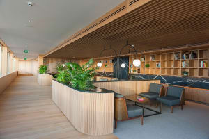 Industrial style coffee shop featuring wood, marble, and metal elements.