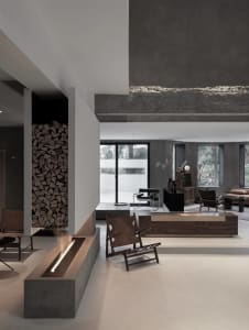 Modern living room with a concrete wall and minimalist furniture.