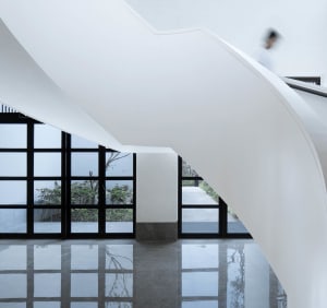 Modern concrete staircase with sleek lines and natural light.