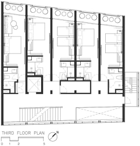 Modern office space featuring metal and glass materials on the third floor with a floor plan layout