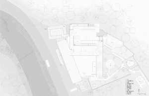 A detailed paper-based architectural floor plan depicting a modern design structure with labeled rooms and outdoor spaces.