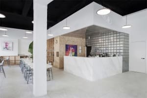 Modern cafe with marble ceiling and glass walls