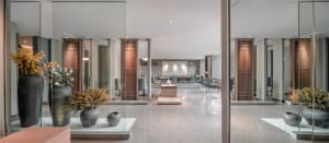 Modern lobby design featuring concrete and glass elements.