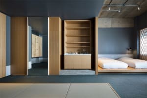 A modern bedroom featuring wooden materials and furniture.