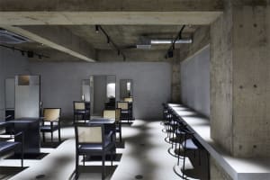 Concrete restaurant with industrial seating