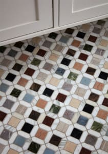 A patterned mosaic floor made of various marble tiles
