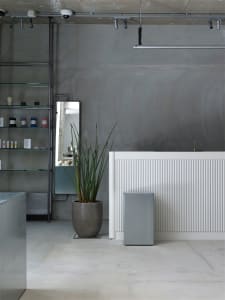 Industrial retail store interior with concrete walls and minimalist design