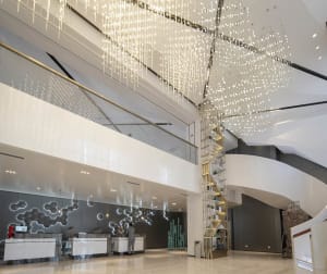 A modern lobby interior featuring circular patterns and contemporary materials.