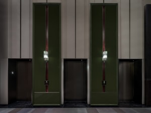 Modern lobby interior with metal, glass, and wooden elements