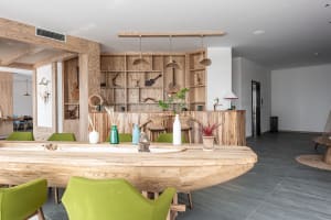 A modern restaurant bar interior with wooden elements and stylish decor.