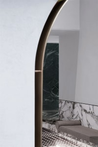 Modern interior design of a retail storefront featuring contemporary concrete and marble elements.