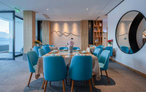 Modern blue leather chairs in a contemporary restaurant dining room setting with a contemporary design aesthetic.