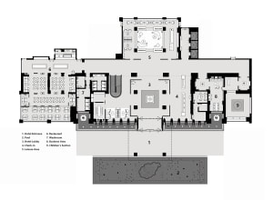 Schematic floor plan of a hotel interior showing various rooms and areas like lobby, restaurant, business area, and children'
