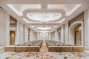 An spacious interior design for a modern conference room featuring marble and glass materials.