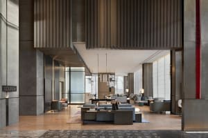 Industrial-style lobby with concrete walls and floors
