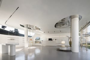 Modern, white-themed coffee shop with metal accents