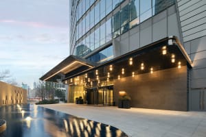 A modern office building with a glass and concrete exterior.