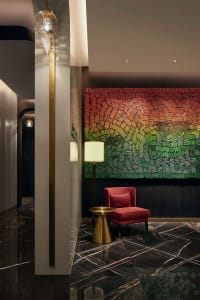 A modern lobby featuring a marble floor with a concrete texture pattern.