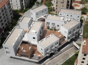A modern residential building with a concrete exterior.