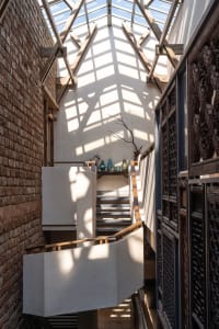 A modern interior design featuring wooden beams
