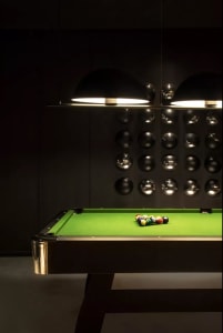 Industrial-style metal pool table with green felt