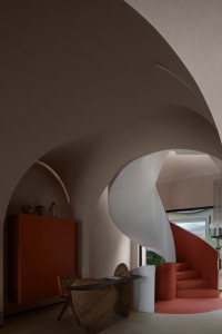 A modern interior design featuring a concrete staircase and arches.