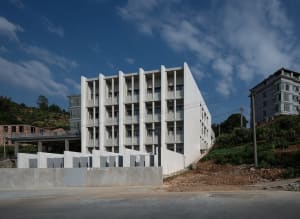 A modern office building made of concrete.