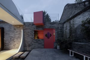 A modern building with a brick exterior and concrete accents.