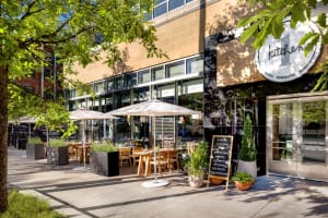 Modern restaurant exterior with concrete and glass materials