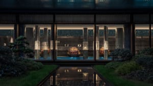 Modern hotel suite featuring glass columns in a sleek, contemporary design.