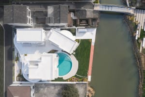 Modern residential architecture featuring concrete and glass materials.