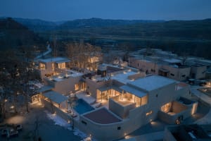 A modern residential exterior showcasing concrete materials and a minimalist design.