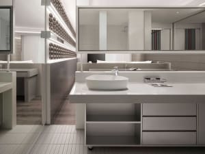 Modern bathroom designed with white ceramic tiles and minimalist fixtures.