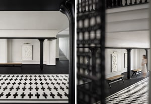 An entrance hallway featuring modern design with concrete floor tiles in black and white color scheme.