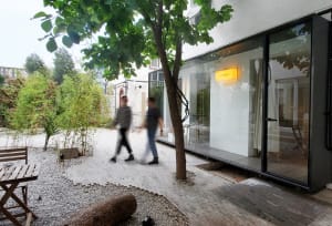 A modern interior design featuring glass walls