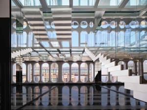 Modern office lobby with glass walls and steel accents