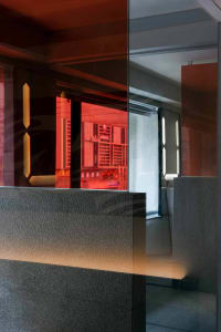 An image of a modern hotel lobby with glass walls.